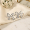 Shimmering Crystal Ribbon Bow Studs – Elegant Feminine Statement Earrings