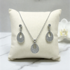Shimmering Crystal Teardrop Suite – Elegant Open-Frame Pendant & Drop Earring Set