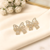 Shimmering Crystal Ribbon Bow Studs – Elegant Feminine Statement Earrings