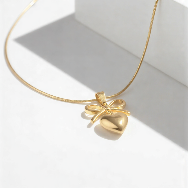 Radiant Ribbon Heart Suite – Elegant Bow Pendant & Snake Chain Necklace