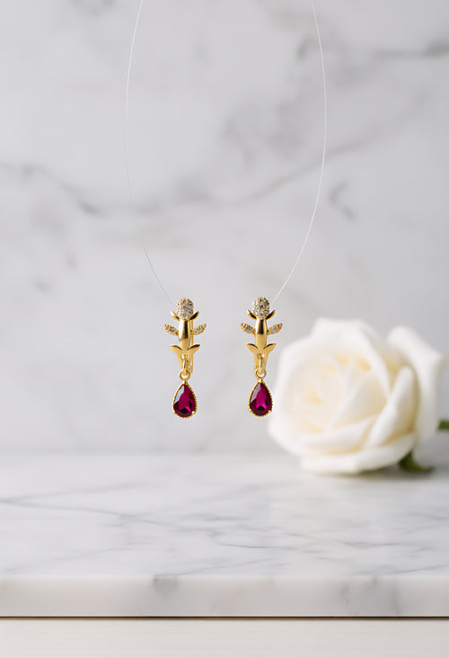 Lumina Luxe nature-inspired earrings with a golden-tone leaf motif and a diamond-inspired crystal clear teardrop drop
