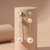 Elegant Dual-Pearl Drop Earrings – High-Shine Geometric Studs..