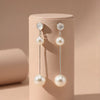 Elegant Dual-Pearl Drop Earrings – High-Shine Geometric Studs..