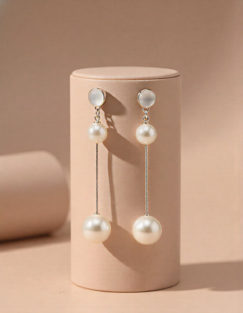 Elegant Dual-Pearl Drop Earrings – High-Shine Geometric Studs..