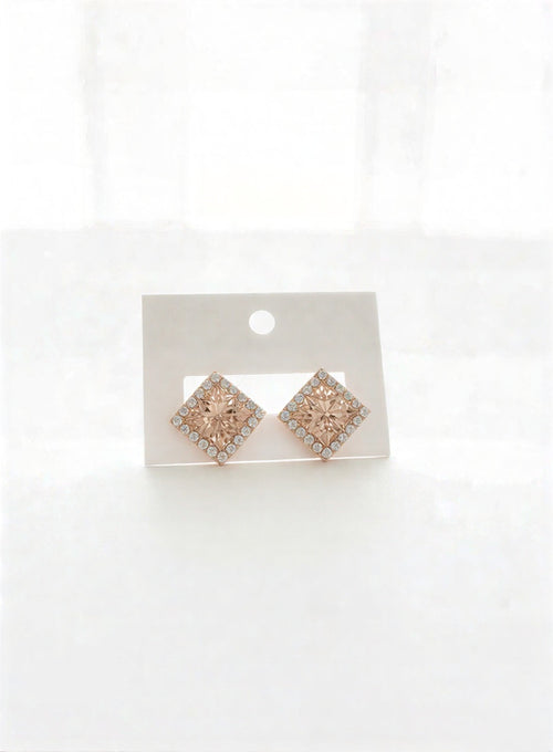 Elegant floral hanging earrings for wedding guest look.