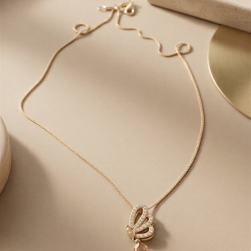 Elegant Crystal Butterfly Pendant Necklace – Rose-Gold Tone Chain with Pear-Cut Drop Stone
