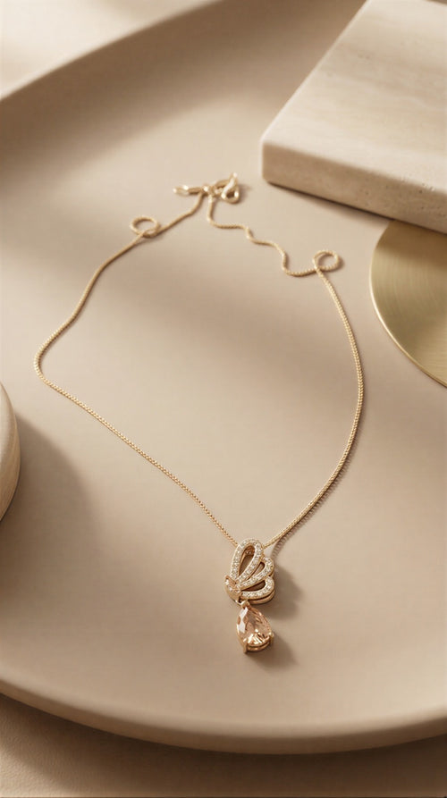 Elegant Crystal Butterfly Pendant Necklace – Rose-Gold Tone Chain with Pear-Cut Drop Stone