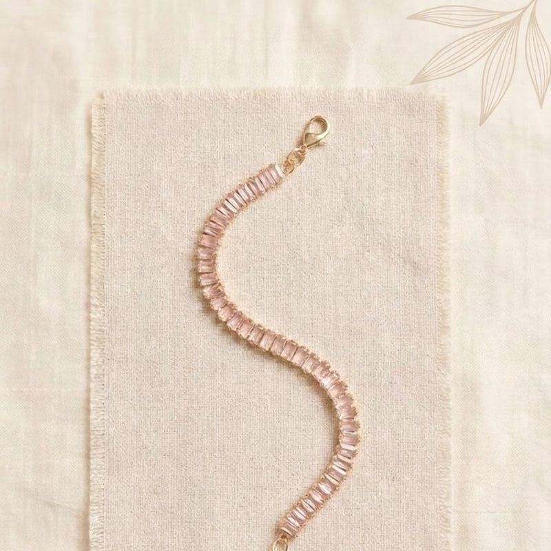 Elite Single-Strand Tennis Bracelet Featuring Baby Pink Emerald-Cut Crystals in a Radiant Gold-Tone Adjustable Frame