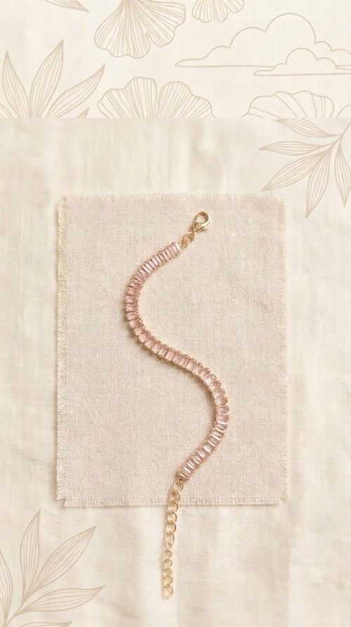 Elite Single-Strand Tennis Bracelet Featuring Baby Pink Emerald-Cut Crystals in a Radiant Gold-Tone Adjustable Frame