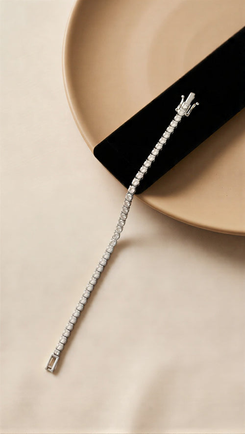 The Prestige Dual-Tone Gallery: A Curated Selection of Luxury Baguette-Cut and Brilliant-Stardust Tennis Bracelets in Radiant Gold and Polished Silver Finishes