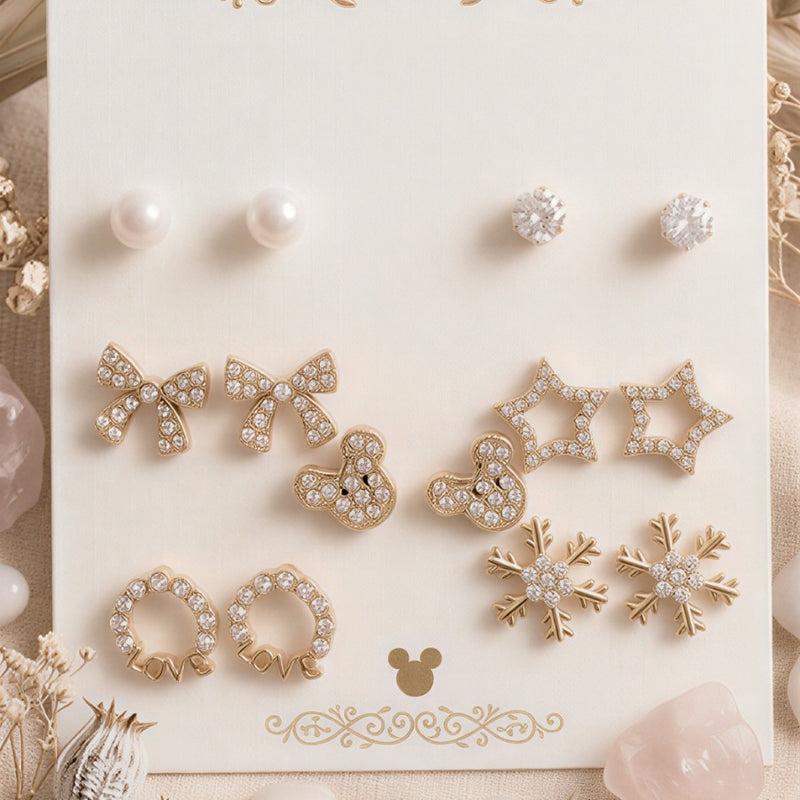 A Grand 14-Piece Curated Collection of Swan, Pearl, and Butterfly Icons in a Lustrous Gold-Tone Finish