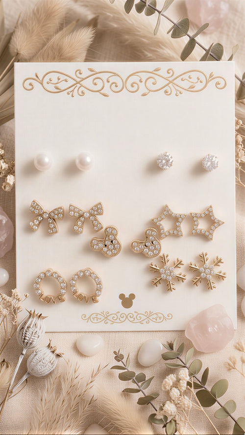 A Grand 14-Piece Curated Collection of Swan, Pearl, and Butterfly Icons in a Lustrous Gold-Tone Finish