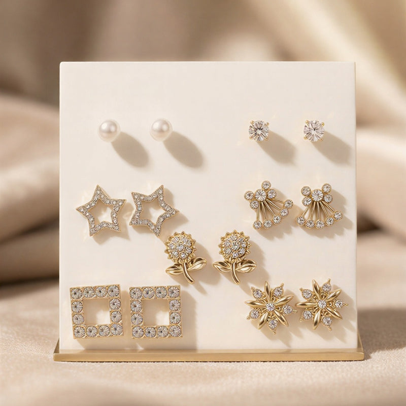 The Whimsical Gold Charm Gallery: A Premium 8-Piece Curated Earring Set Featuring Pearl, Star, Snowflake, and Signature Motif Studs in a Radiant Gold-Tone Finish