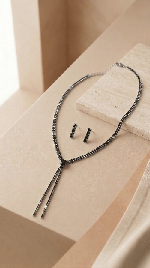 A Masterpiece Tassel Necklace Featuring Onyx-Black Crystals and Polished Metallic Detailing for a Bold, Sophisticated Look.