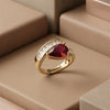 An Elite Adjustable Gold-Plated Ring Featuring a Deep Red Teardrop Stone and Precision-Set Baguette Zircons.