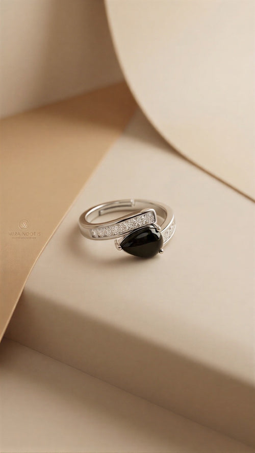 A Sophisticated Adjustable Ring with a Soft Pink Teardrop Stone and Precision-Set Crystals in Dual Metallic Finishes.