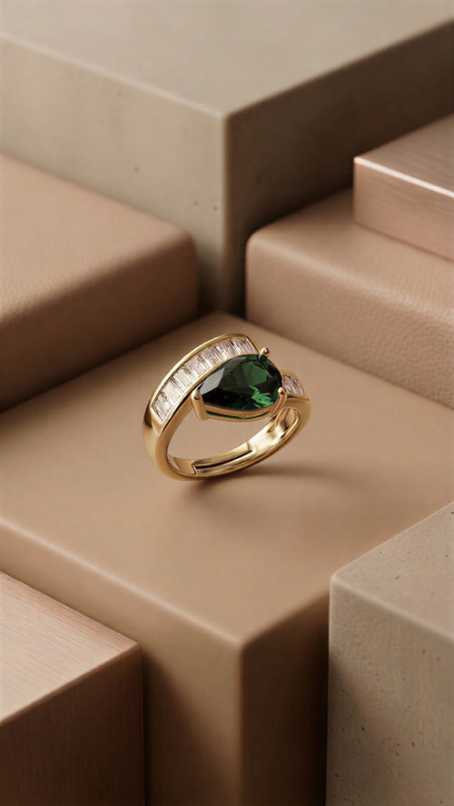 The Emerald Majesty: A Sophisticated Pear-Cut Emerald Green Statement Ring with Radiant Baguette Diamond Accents in a High-Definition Silver Finish
