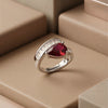 An Elite Adjustable Gold-Plated Ring Featuring a Deep Red Teardrop Stone and Precision-Set Baguette Zircons.