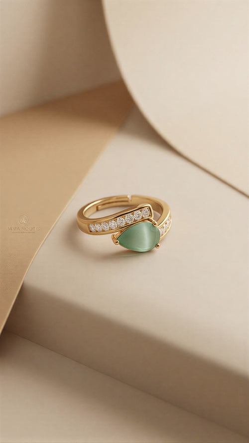 : A High-Definition Statement Ring Showcasing a Translucent Mint Teardrop and Precision-Engineered Accents in Gold & Silver Variations.