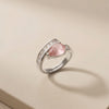A Sophisticated Adjustable Ring with a Soft Pink Teardrop Stone and Precision-Set Crystals in Dual Metallic Finishes