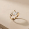 A Transcendent Pear-Shaped Crystal Masterpiece Featuring Geometric Baguette Alignment, Available in Radiant Gold and Sterling Silver Tones.