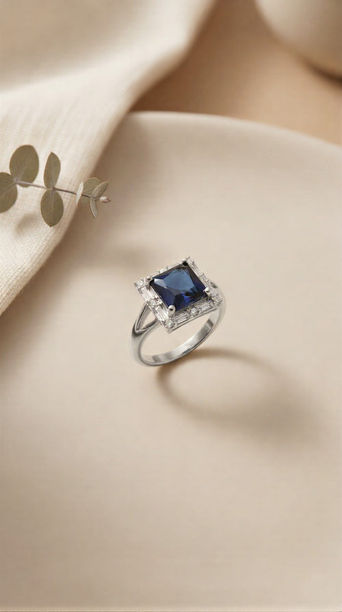 Imperial Cobalt Solitaire: Gold & Silver Polish Radiant Blue Ring