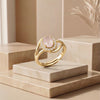 The Auric Bloom: Rose Quartz Halo Ring with Swirl-Shank Detail