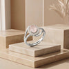 The Auric Bloom: Rose Quartz Halo Ring with Swirl-Shank Detail