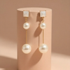 Elegant Dual-Pearl Drop Earrings – High-Shine Geometric Studs